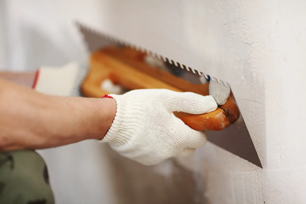 Insulation boards being installed on an external wall